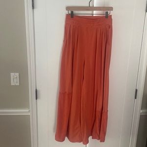 FreePeople “movement “orange wide leg sweat pant . Size medium